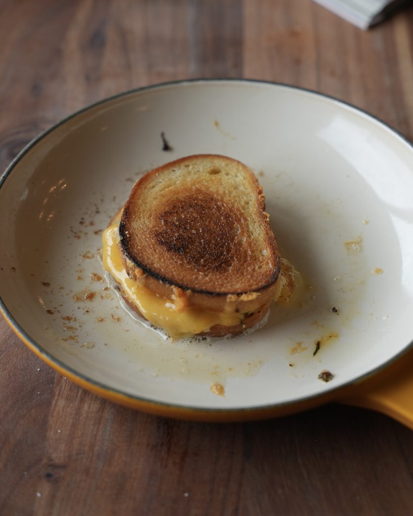 A grilled cheese toasted golden in the skillet