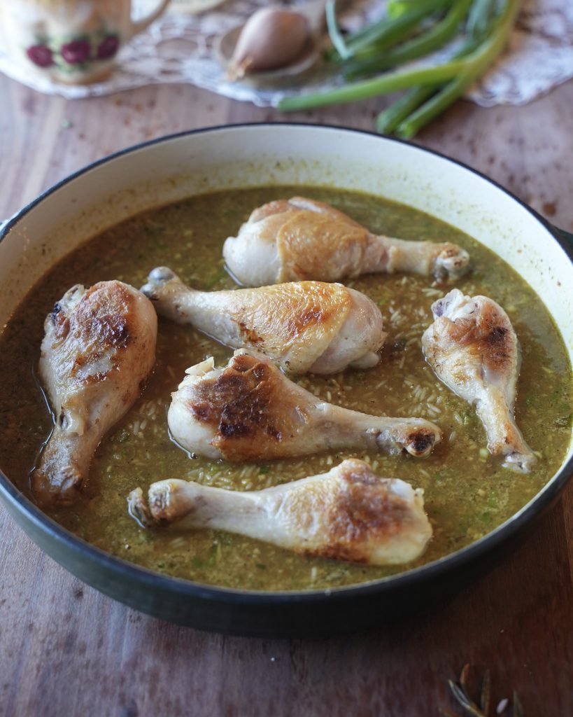 Seared drumsticks nestled into rice and broth before baking